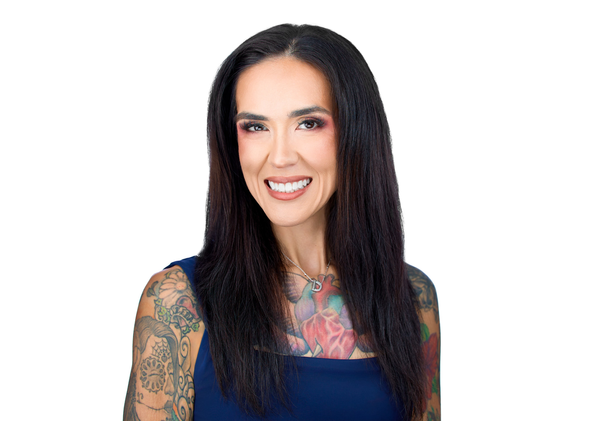 Dani Raschel Chou headshot in a navy top, smiling.